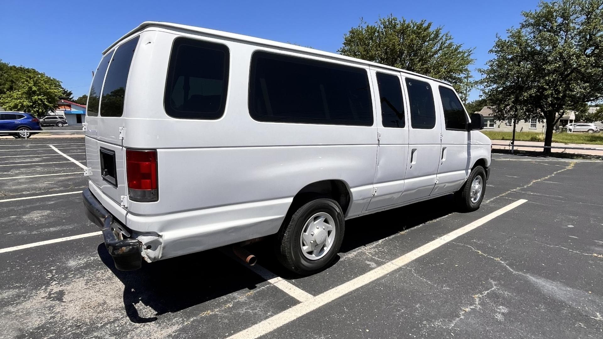 2012 white Ford E-Series Wagon (1FBSS3BL2CD) , located at 945 E. Jefferson Blvd, Dallas, TX, 75203, (214) 943-7777, 32.752514, -96.811630 - Photo#2